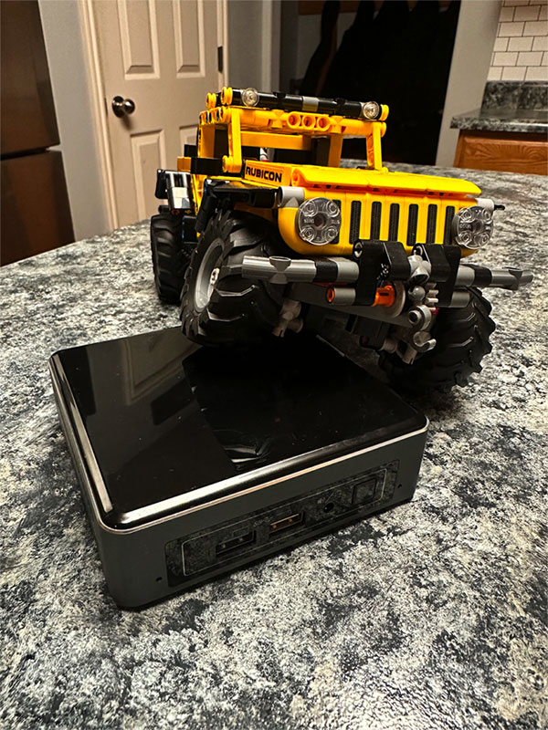 Intel NUC being crawled by a Lego Jeep Rubicon